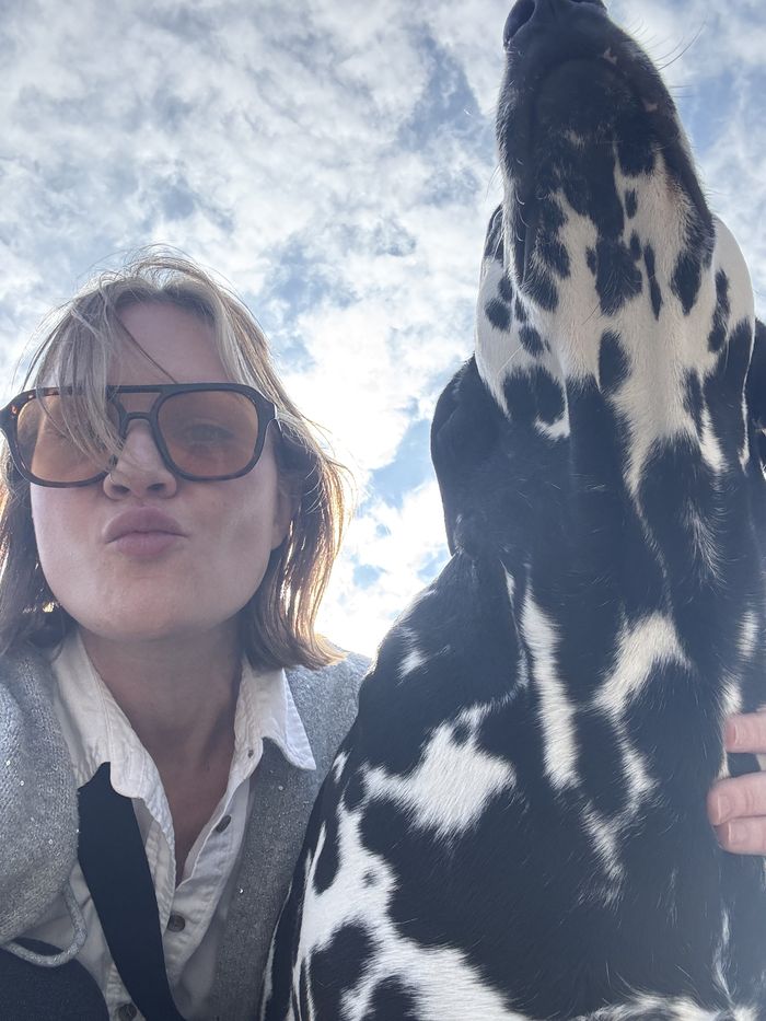Alane Atchley taking a selfie with her Dalmatian
